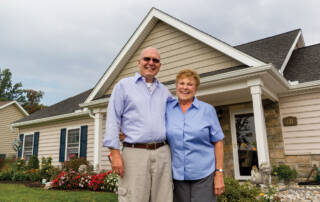 Couple outside of cottage