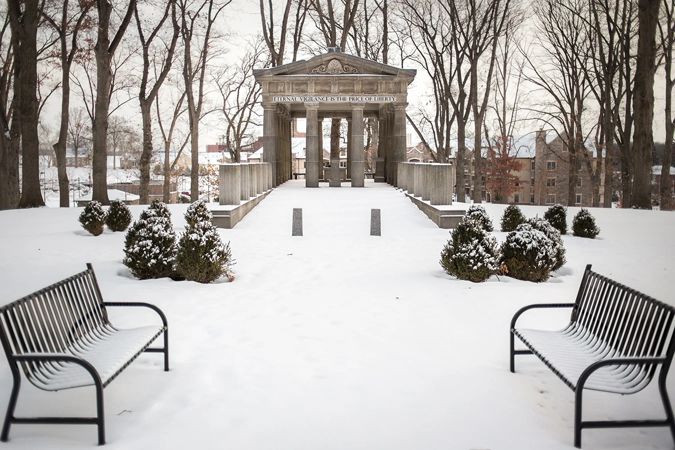 IMG_0431 Snow-covered veterans grove with a pathway leading up to a loggia.