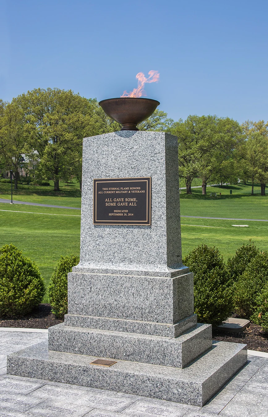 IMG_1810 An eternal flame on a stone monument dedicated to veterans.