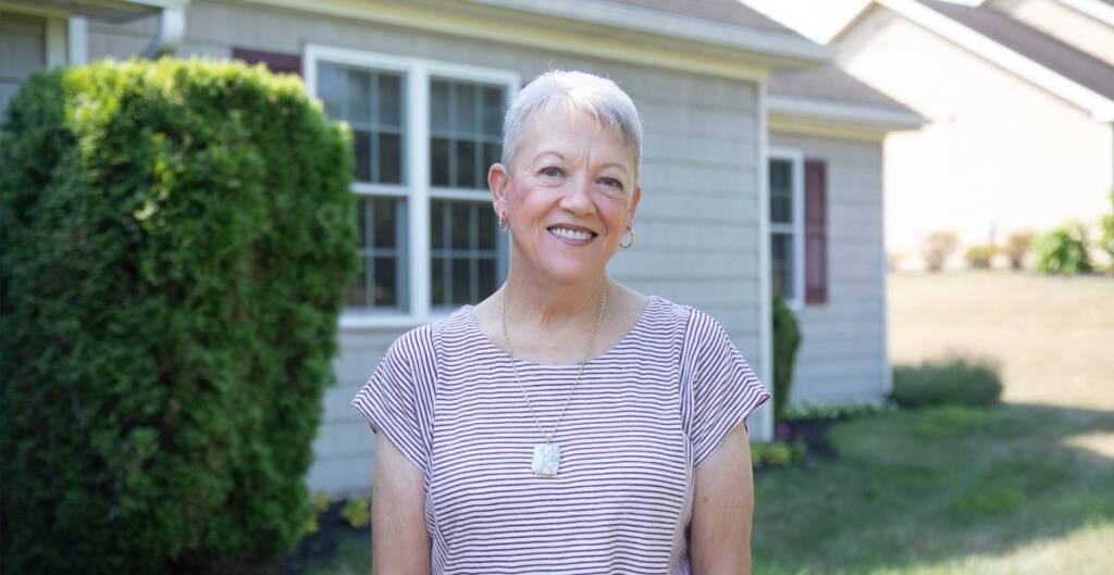 Smiling woman standing outdoors